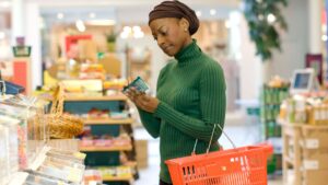 woman looking at product packaging