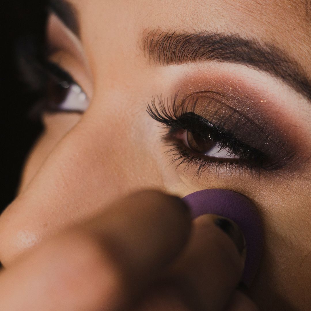 woman applying eye make up